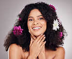 Skincare, smile or face of black woman with flowers in hair for spring, luxury spa or self care. Aesthetic, beauty facial portrait or girl with plants for happiness or cosmetics product in studio
