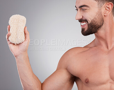 Buy stock photo Hygiene, man and sponge for cleaning, smile and wellness with guy on grey studio background. Male, gentleman and skincare for washing, happiness and grooming routine for health, smooth and soft skin