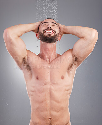 Buy stock photo Water drops, body and beauty man isolated on studio background with shower for face cleaning and skincare. Strong, Portugal and fitness model or person washing for hygiene, wellness and dermatology