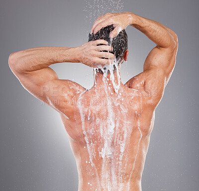 Buy stock photo Shower, cleaning and back of man with soap on gray background for wellness, grooming and beauty. Skincare, bathroom hygiene and male smile for washing body, clean face and water for healthy skin