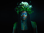 Black woman, portrait and plant crown beauty face and makeup on dark background with tropical leaf. Fairy model person or Queen of nature, ecology and sustainability for natural wreath art freedom