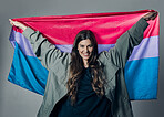 Bisexual flag, pride and happy woman, lgbtq and freedom to love, inclusion and equality, protest for human rights. Gay, trans and identity, politics and community in portrait on studio background