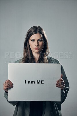 Buy stock photo Woman, protest and poster in pride for self esteem, equality or human rights against gray studio background. Portrait of confident female activist with I am me message on board for unique empowerment