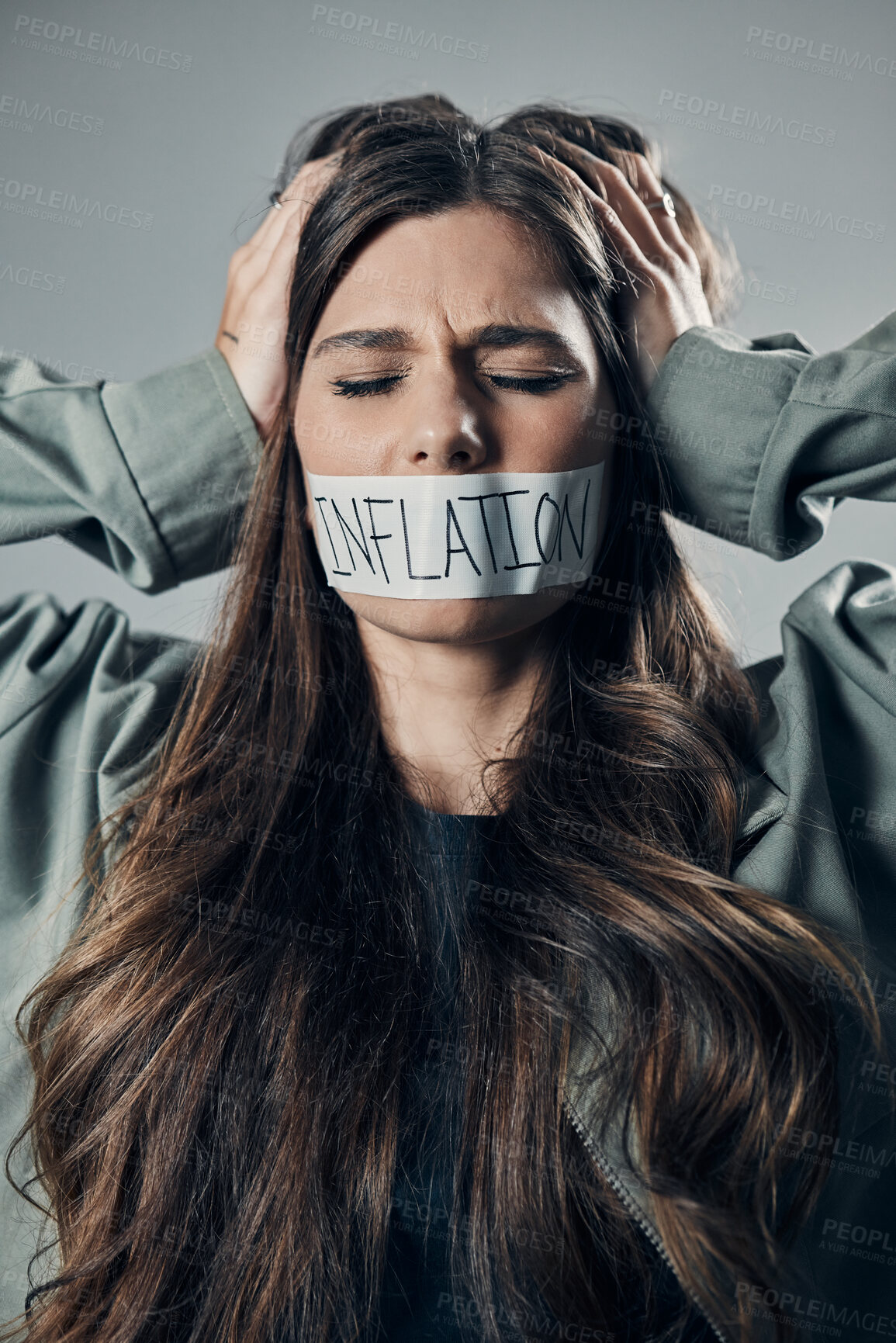 Buy stock photo Woman, tape and mouth with quiet protest, social activism and global economy crisis by background. Inflation, gen z girl and studio backdrop with economic opinion, stress and financial freedom vision