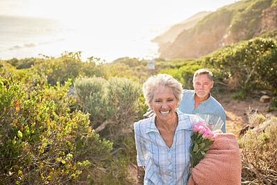 Buy stock photo Hiking, mockup and a senior couple on a valentines day picnic together in the mountains for romance. Nature, love and a mature woman leading her husband along a path in the wilderness for bonding