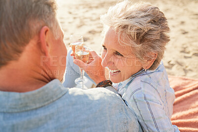 Buy stock photo Champagne, senior beach couple laughing and love with mature care and support of marriage. Toast, wine and sea picnic of a old man and woman together on holiday in summer loving the sunshine outdoor