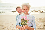 Gift, celebration and senior couple with flowers at the beach for love, care and gratitude in Spain. Happy, vacation and elderly man with a bouquet surprise for a woman on valentines day at the ocean