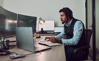 Buy stock photo Headphones, programmer and man on computer with book, coding or programming while writing notes at night. Information technology, notebook and male working on software while streaming music or radio.