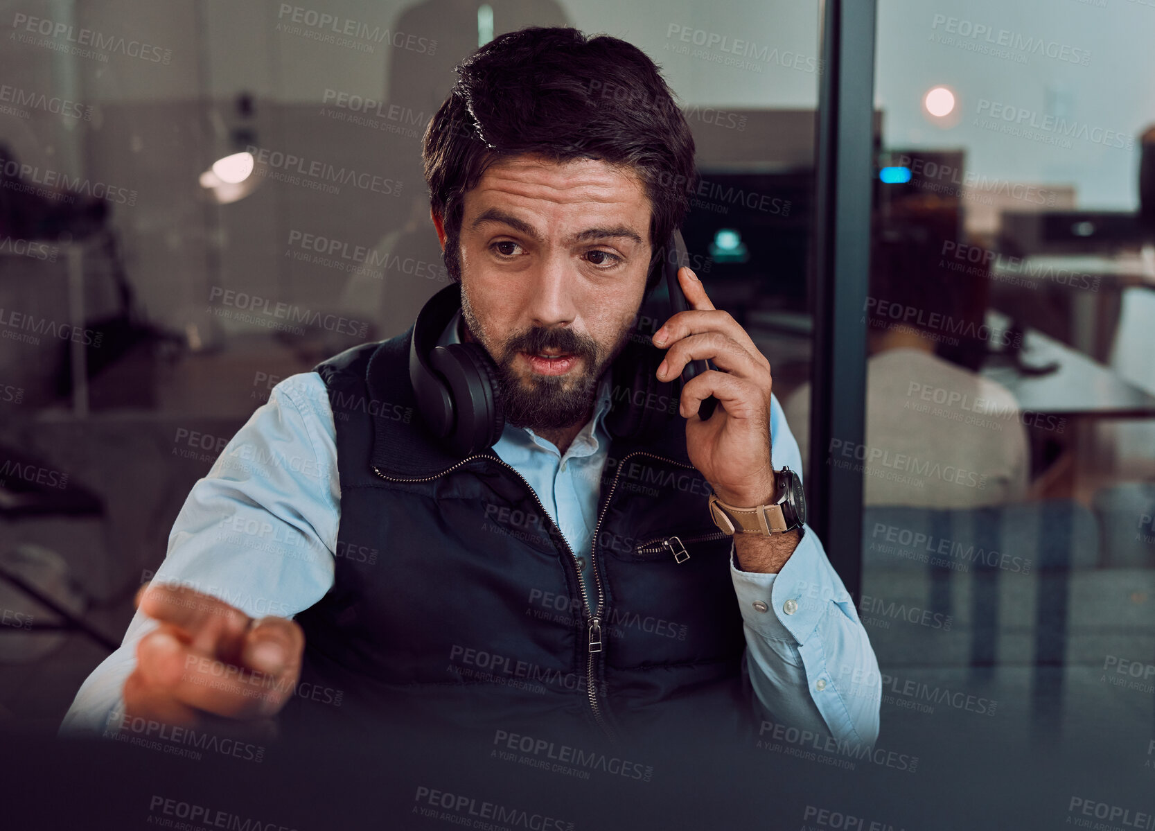 Buy stock photo Phone call, programmer and man talking in office, chatting and speaking to contact at night. Information technology, pointing and thinking male employee or coder with mobile smartphone for networking