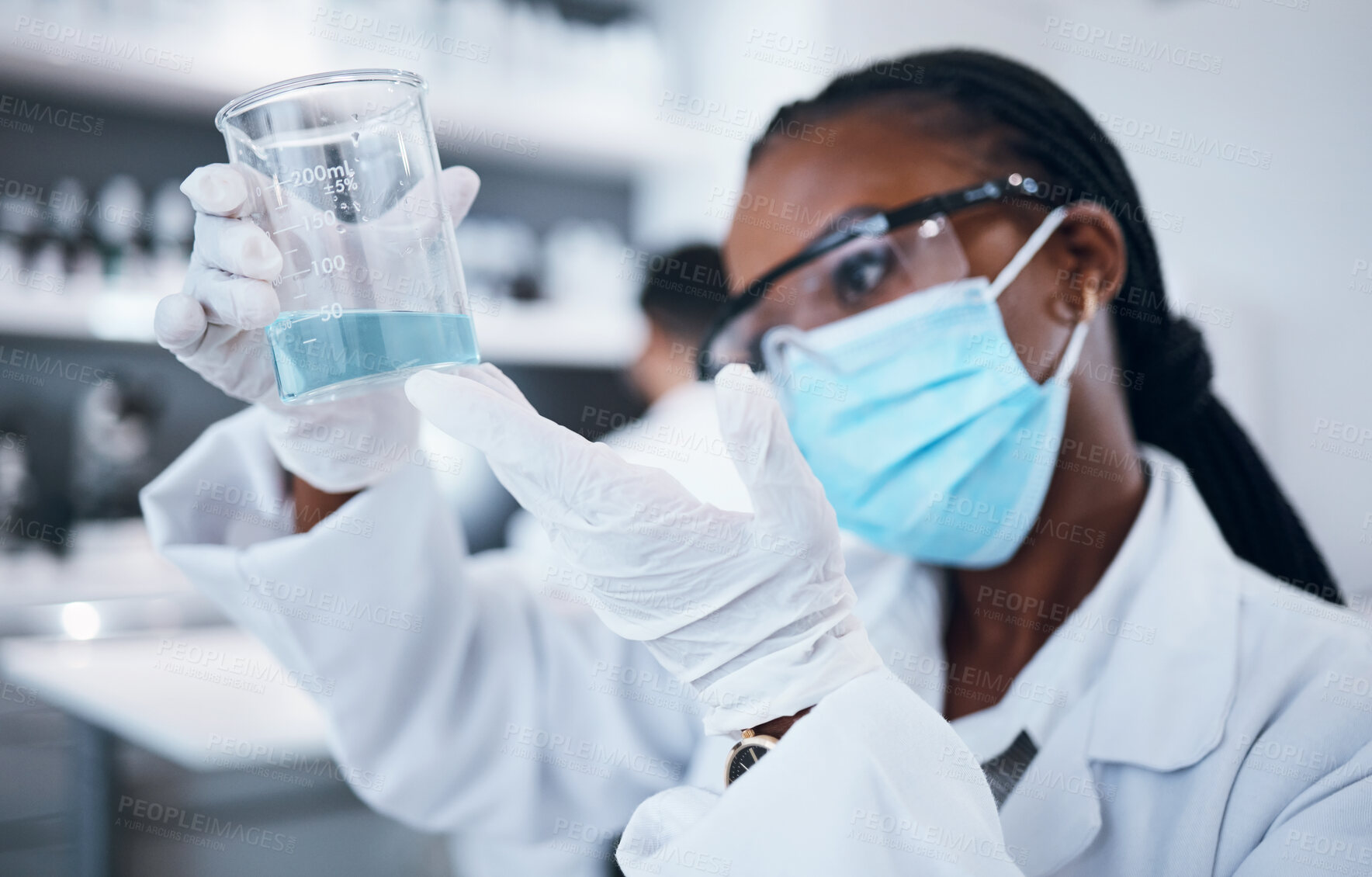 Buy stock photo Science, covid and liquid with a black woman doctor working in a laboratory for research or innovation. Medical, analytics and development with a female scientist at work in a lab for chemistry