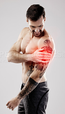 Buy stock photo Injury, inflammation and a man with arm pain and muscle sprain isolated on a grey background. Emergency, broken bone and person touching a painful, broken and hurt area in the body on a backdrop