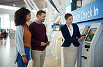 Woman, service agent and couple at airport by self service check in station for information, help or FAQ. Portrait of happy female passenger assistant helping travelers register or book air flight
