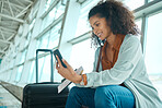 Travel ticket, phone and black woman at airport on a video call waiting for plane and flight. Online, mobile connection and smile of a young female sitting at airplane terminal waiting for transport