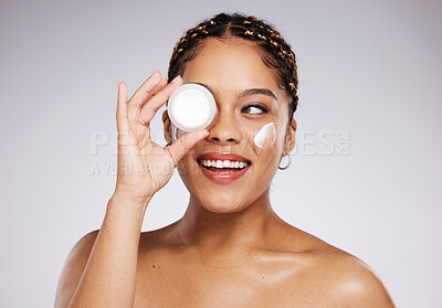 Buy stock photo Skincare, health and woman with face cream in a studio for a beauty, natural and face routine. Cosmetic, wellness and female model with facial creme, spf or moisturizer treatment by a gray background