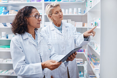 Buy stock photo Tablet, teamwork and pharmacists check stock in pharmacy, drugstore or shop for medication. Medicine, technology and medical doctors or senior women with touchscreen for checking product inventory.