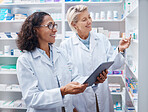 Tablet, teamwork and pharmacist check stock in pharmacy, drugstore or medication shop. Medicine, technology and medical doctors or happy senior women with touchscreen for checking product inventory.