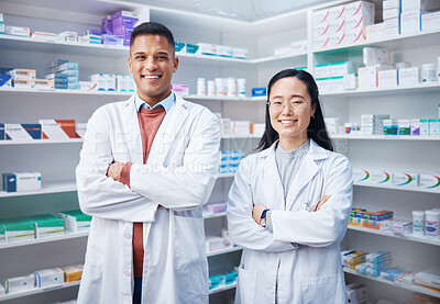 Buy stock photo Portrait, teamwork and pharmacists with arms crossed in pharmacy, drugstore and medicine shop. Healthcare, pharma wellness and happy, proud and confident smile of medical doctors, man and Asian woman