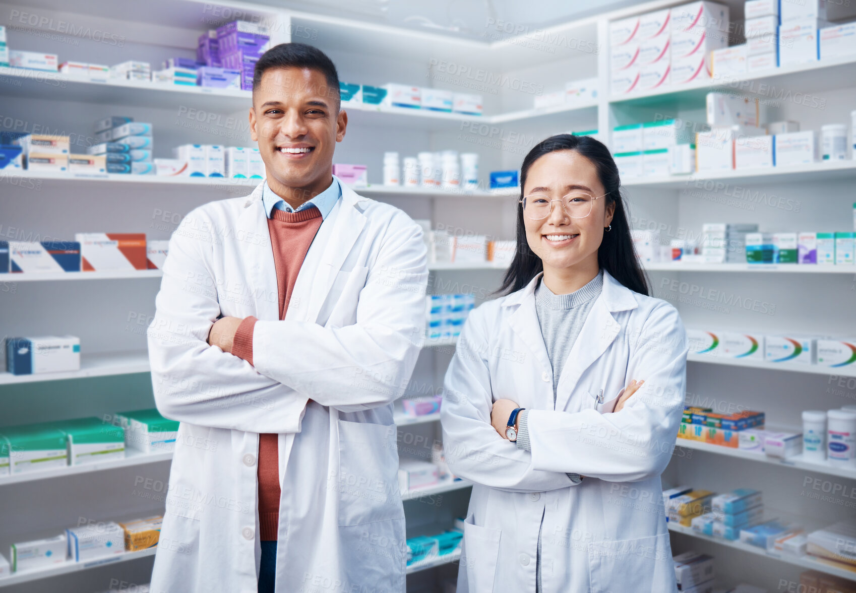 Buy stock photo Portrait, teamwork and pharmacists with arms crossed in pharmacy, drugstore and medicine shop. Healthcare, pharma wellness and happy, proud and confident smile of medical doctors, man and Asian woman