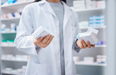 Buy stock photo Pharmacist, pills and medicine with hands of woman in store for healthcare, wellness and retail. Closeup of medical products, pharmacy shopping and boxes of supplements, tablets and package stock 