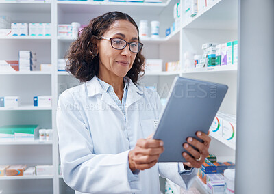 Buy stock photo Senior woman, tablet and pharmacist in pharmacy for healthcare or stock check online in drugstore. Medication, telehealth technology and female medical doctor with touchscreen for research in shop.