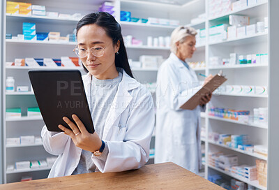 Buy stock photo Tablet, Asian woman and pharmacist in pharmacy for healthcare or online consultation in drugstore. Medication, telehealth technology and female medical doctor with touchscreen for research in shop.