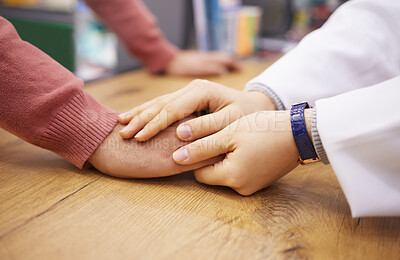 Buy stock photo Medical, support and empathy with people holding hands in pharmacy for consulting, thank you and wellness. Healthcare, medicine and trust with girl and consultant for kindness, gratitude and faith