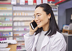 Pharmacy, phone and healthcare worker talking with a mobile connection at work. Asian woman, pharmacist and business communication of a dispensary employee with a smile from conversation in store