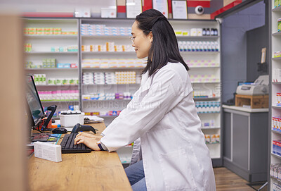 Buy stock photo Pharmacy, woman from Japan and checkout counter for prescription drugs and customer service. Healthcare, pills and asian pharmacist in retail store typing on computer to check stock inventory online.