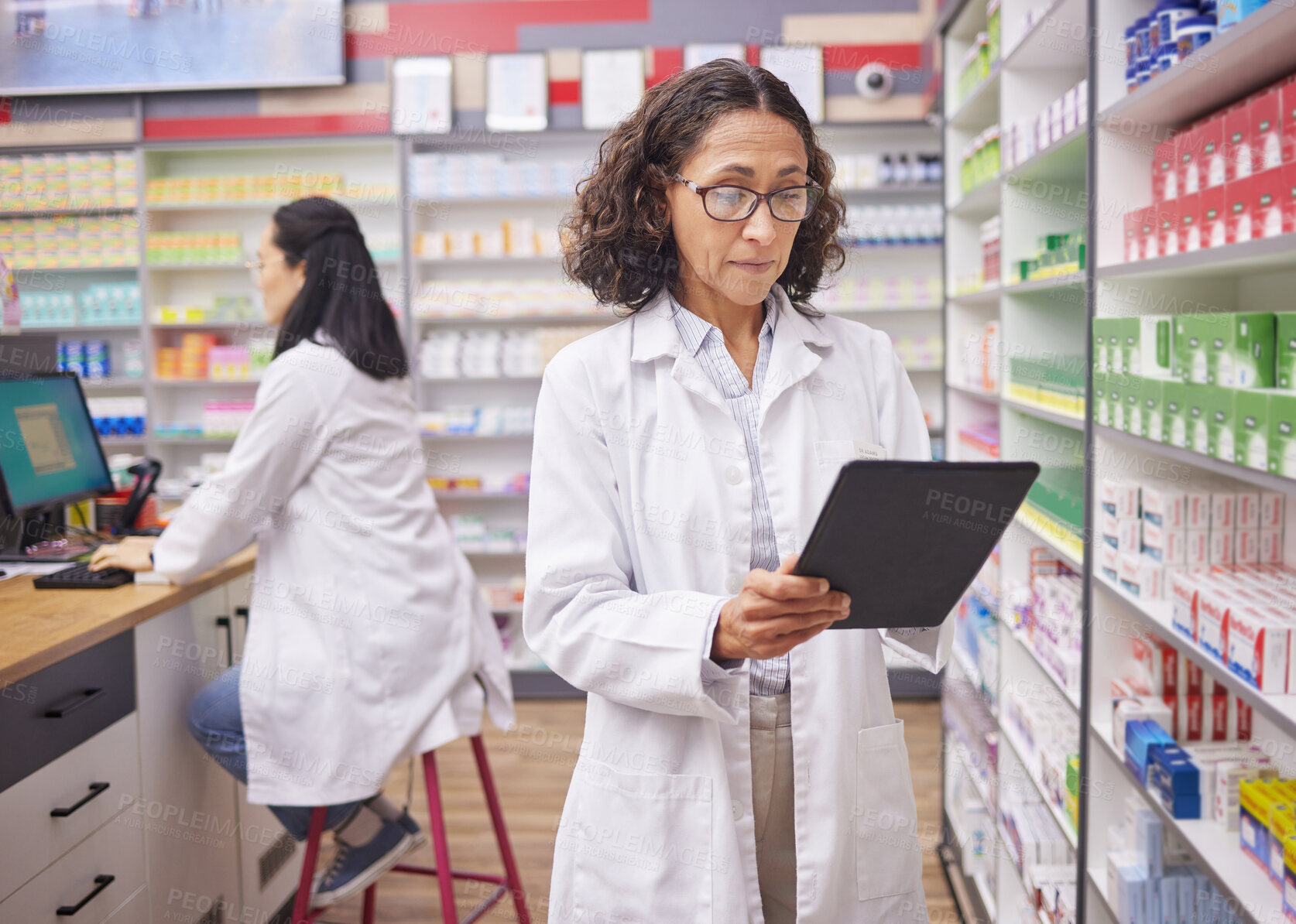 Buy stock photo Pharmacy medicine, pharmacist woman and tablet product management, stock research and inventory. Digital technology, retail logistics and mature medical doctor or person with pharmaceutical database