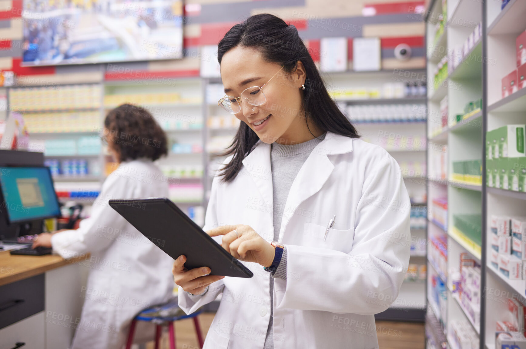 Buy stock photo Pharmacy, tablet and asian pharmacist woman for medicine management, stock research and inventory. Digital technology, retail logistics and healthcare doctor or person with ecommerce product software