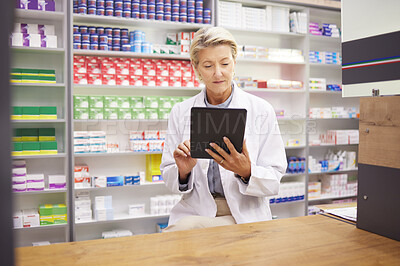 Buy stock photo Tablet, pharmacy and pharmacist woman for product management, stock research and inventory data app. Digital technology, retail logistics and senior healthcare doctor or person with medicine software