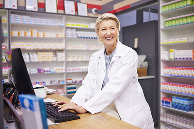 Buy stock photo Pharmacy, smile and portrait of woman pharmacist at counter in drugstore, happy customer service and advice in medicine. Prescription drugs, senior employee typing at checkout with pills and medicine