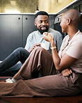 Conversation, happy and African couple with coffee for peace, love and care on the kitchen floor. Communication, smile and black man and woman drinking tea while talking about their relationship