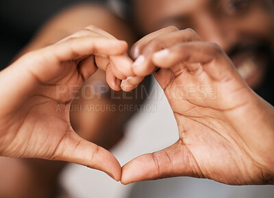 Love, hands in heart and happy black couple for relationship, dating and commitment in home. Valentines day, emoji sign and black woman and man smile with hand shape for bonding, romance and trust