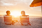 Beach, back and couple holding hands during the sunset for support during a date on valentines day. Travel, relax and man and woman with affection, trust and conversation sitting by the ocean