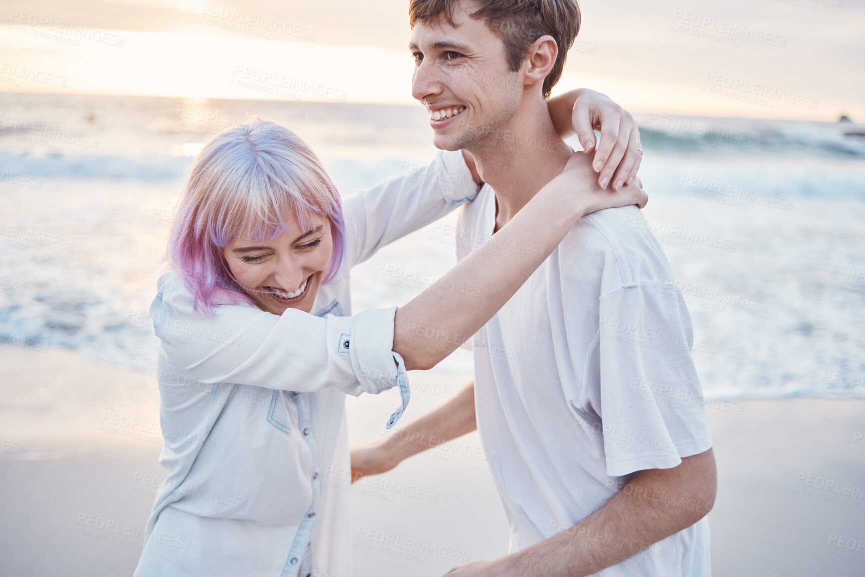 Buy stock photo Love, beach and couple on date for valentines day, ocean fun and romantic embrace at sunset. Romance, happiness and gen z woman and happy man hug on tropical valentine holiday in Indonesia in evening