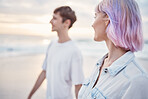Gen z couple, beach walk and sea holiday of students on vacation at sunset. Ocean, walking and relax young people together with love, care and support outdoor feeling calm with blurred background