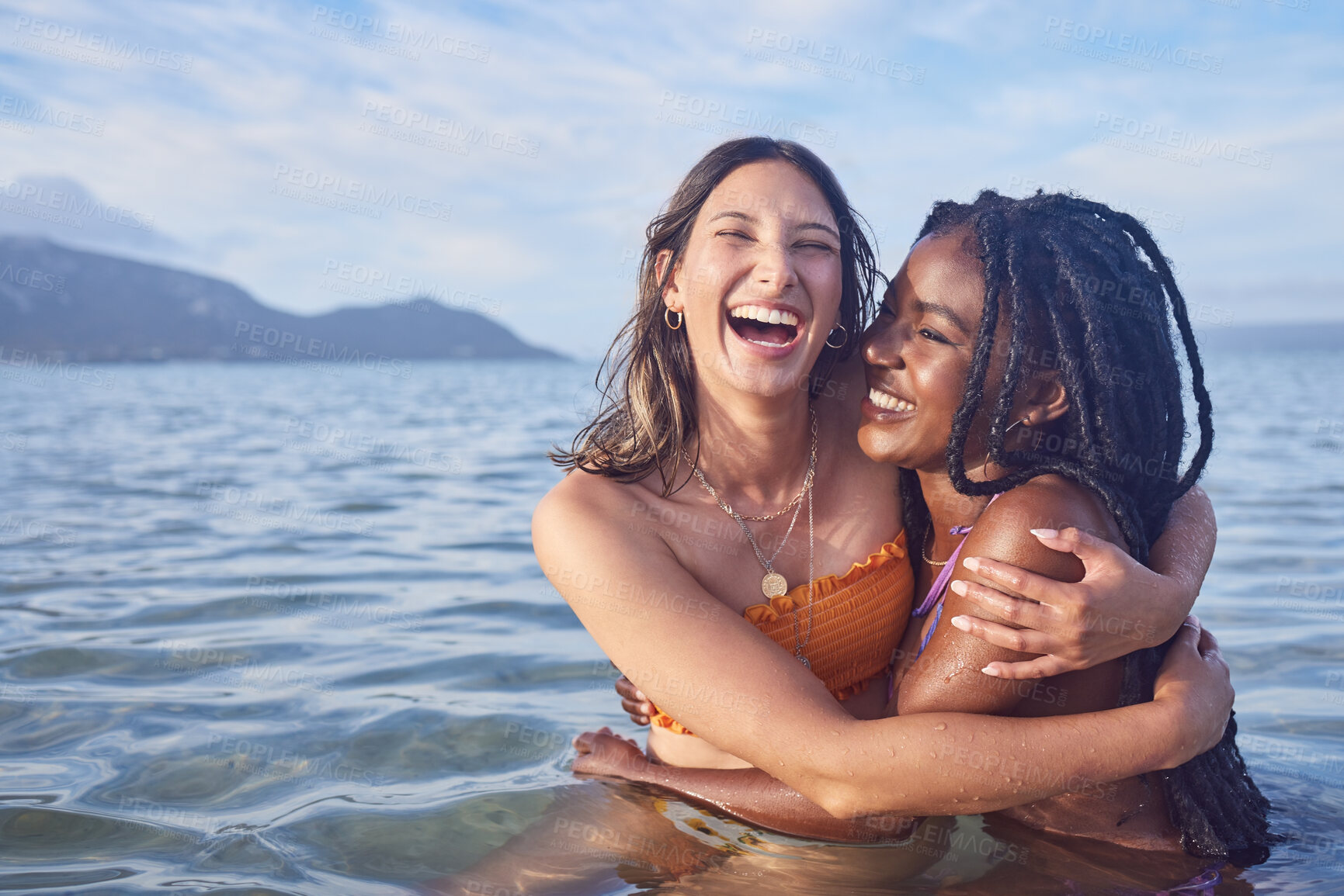 Buy stock photo Funny, ocean and happy with friends swimming at beach for relax, summer break and vacation with blue sky mockup. Travel, bonding and diversity with women for peace, nature and tropical holiday