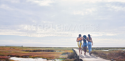 Buy stock photo Relax, happy and boardwalk with friends at beach for travel vacation, support or summer break with sky mockup. Diversity, holiday and nature with women walking together for bonding, hug or peace