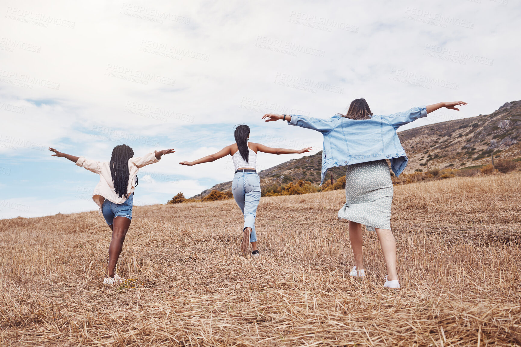 Buy stock photo Freedom, nature and friends running together outdoor for adventure, fun or exploring the wilderness. Run, autumn and excited with a woman friend group playing outside while bonding from the back