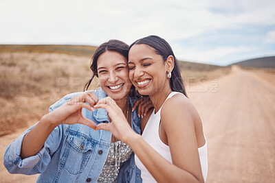 Buy stock photo Friendship, heart shape and women in nature on a holiday, adventure or weekend trip together. Happy, smile and female best friends with love hand gesture, sign or emoji on vacation in the countryside