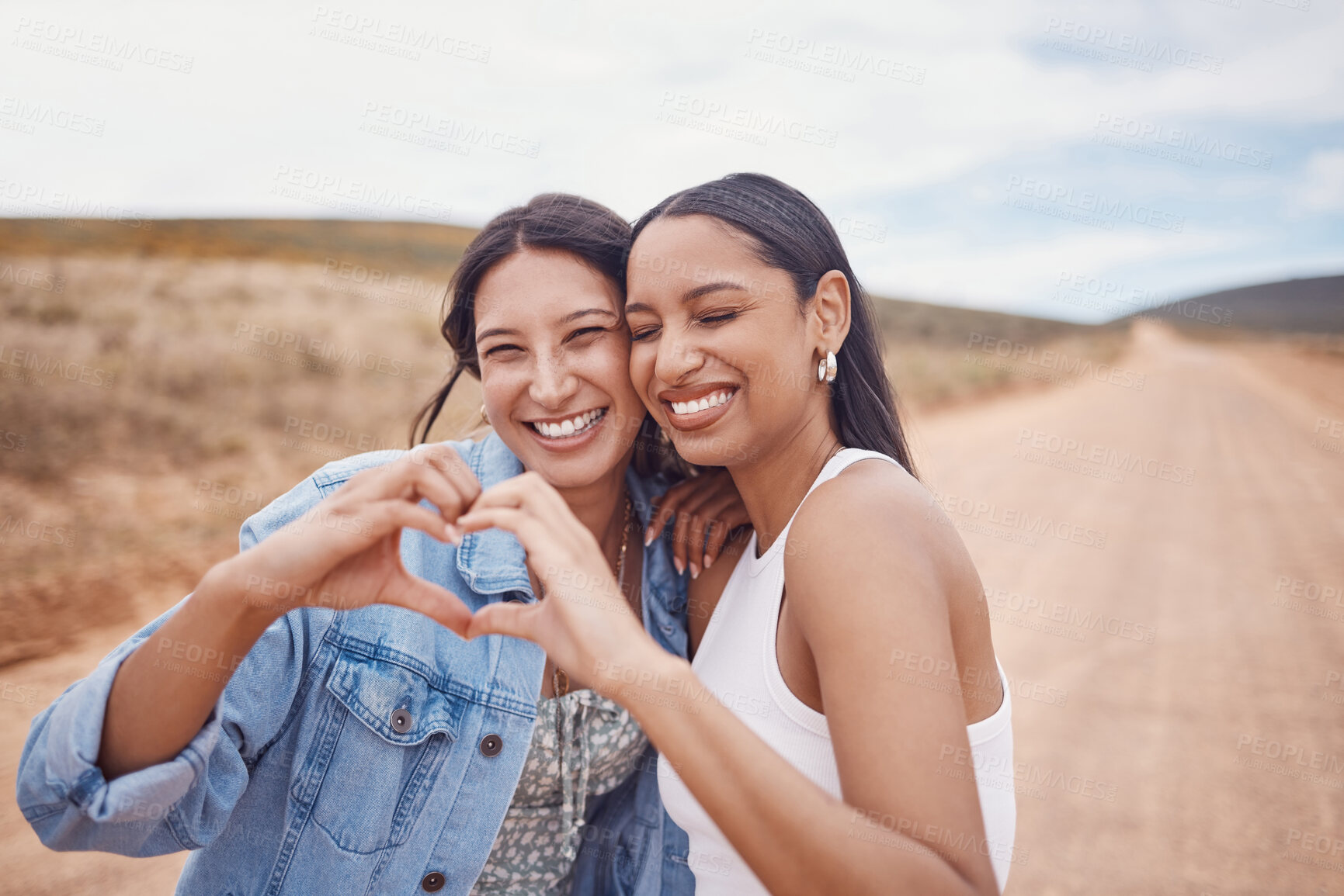 Buy stock photo Friendship, heart shape and women in nature on a holiday, adventure or weekend trip together. Happy, smile and female best friends with love hand gesture, sign or emoji on vacation in the countryside