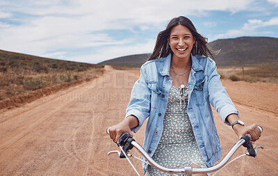 Buy stock photo Happy, desert and portrait of a woman on a bike for travel, road trip and adventure in Sweden. Smile, ride and girl riding a bicycle for adventure, journey and traveling in the countryside nature