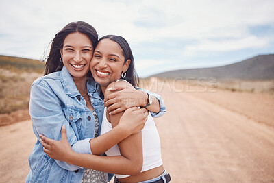 Buy stock photo Portrait, hug and friends on a road trip with mockup on a dirt road outdoor in nature for adventure together. Desert, travel or freedom with a young woman and friend hugging outsode on holiday