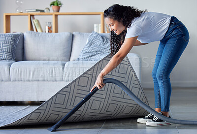 Buy stock photo Woman, vacuum and cleaning carpet floor in housekeeping for clean sanitary hygiene at home. Happy female cleaner in germ or dust removal in living room interior by sofa for daily chores or routine