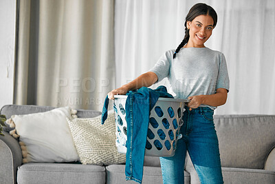 Buy stock photo Laundry, clothes and portrait of woman with basket for cleaning, housekeeping and maintenance at home. Housework, washing and happy girl in living room carry container for linen, fabric and material