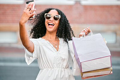 Buy stock photo Fashion, shopping bags and woman taking a selfie in the city standing in the street. Black woman with gifts, 5g phone in hand and taking a picture in retail shopping mall, happy from sale or discount