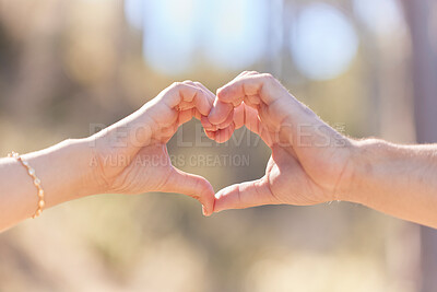 Buy stock photo Heart hands, nature and love, support and commitment partnership for marriage outdoors. Valentines day, romance and couple, man and woman with emoji for care, relationship and affection or trust.