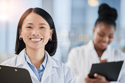 Buy stock photo Asian doctor woman, checklist and portrait with smile, planning or happy at clinic with african expert. Medic, teamwork and clipboard for schedule, analysis or results in hospital for healthcare goal