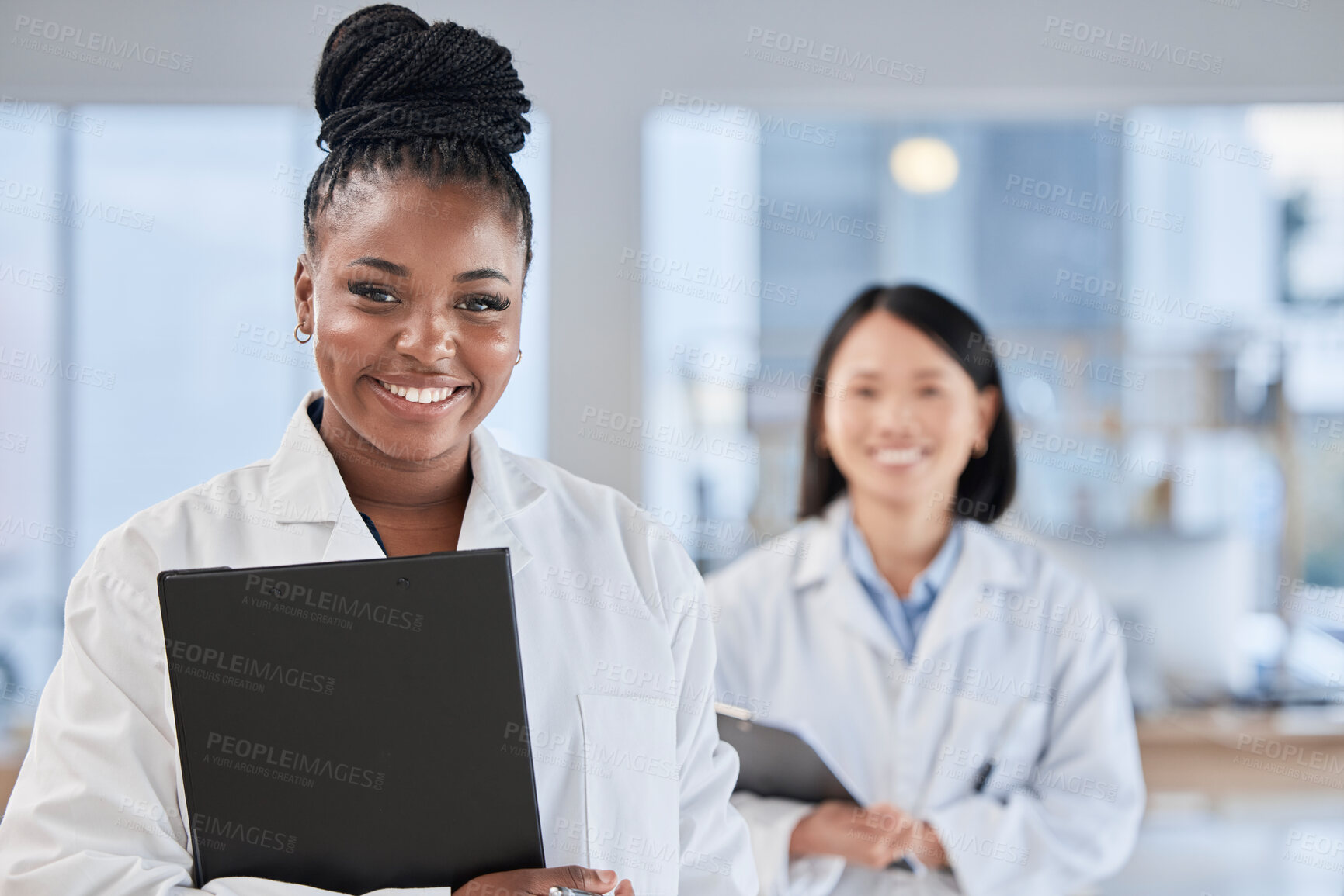 Buy stock photo Doctor black woman, checklist and portrait with smile, planning and happy at clinic with asian expert. Medic, teamwork and clipboard for schedule, analysis and results in hospital for health vision